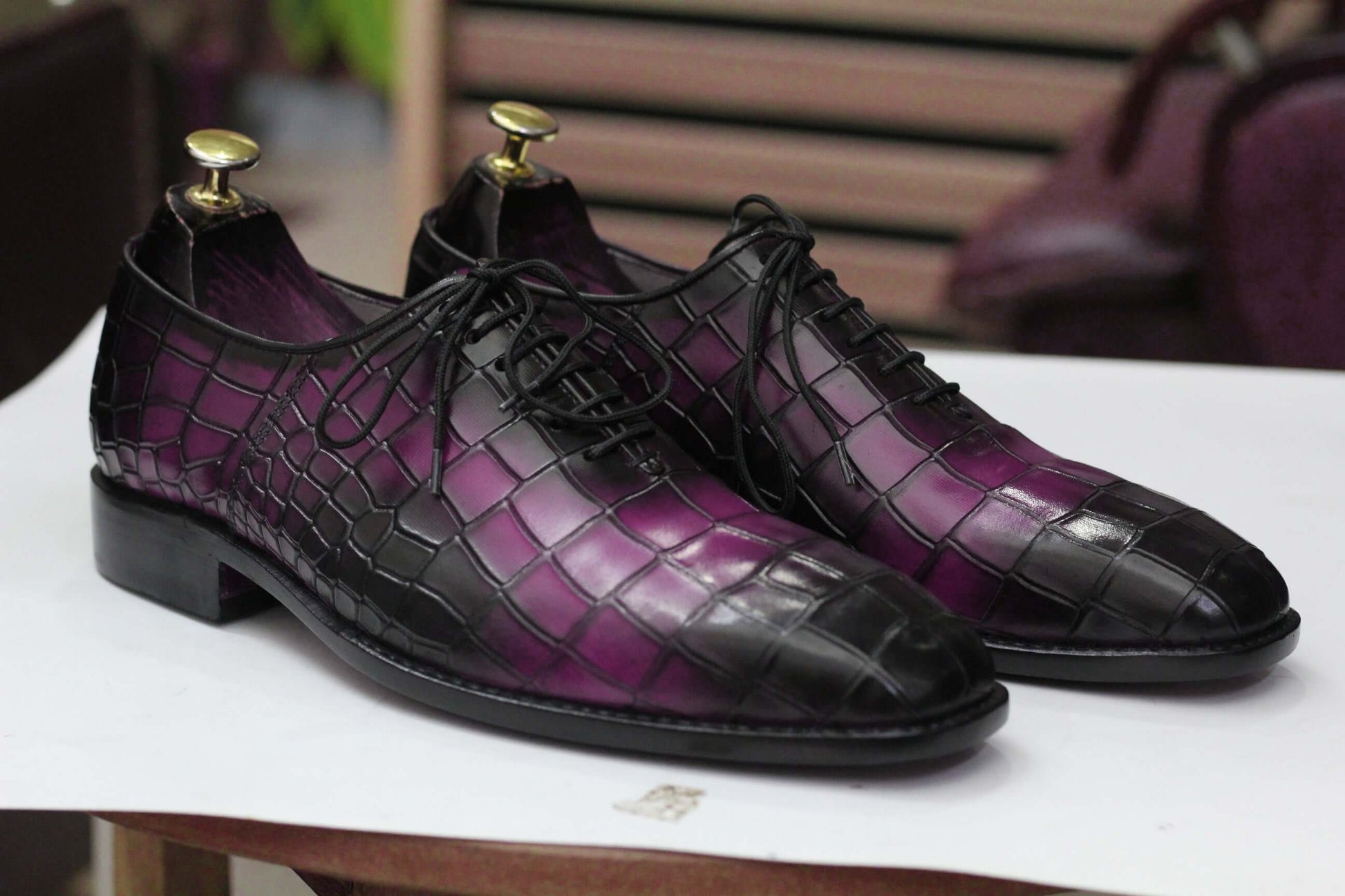 Expertly crafted for durability, these handmade Oxfords showcase a unique alligator print, adding a touch of sophistication to any outfit. Perfect for the stylish and practical man, these shoes are built to last and elevate your wardrobe.