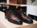 Expertly crafted for durability, these handmade Oxfords showcase a unique alligator print, adding a touch of sophistication to any outfit. Perfect for the stylish and practical man, these shoes are built to last and elevate your wardrobe.