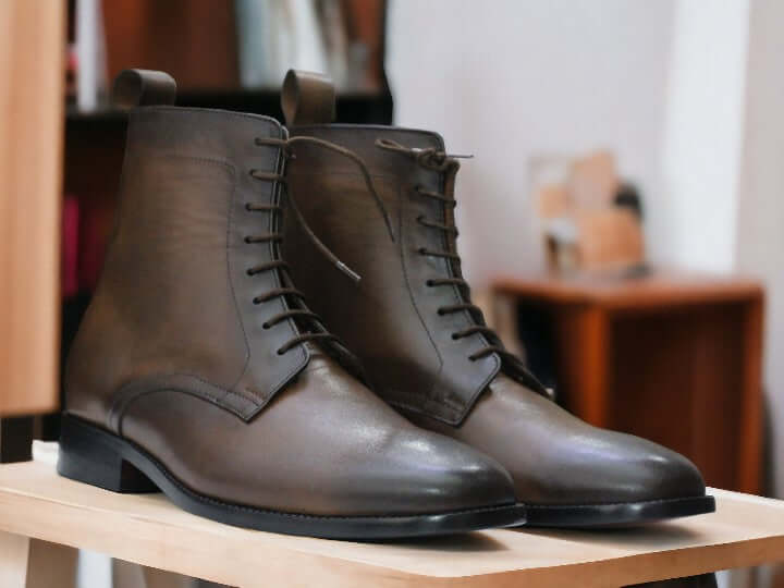 Expertly crafted with genuine leather, these Men's Brown Leather Boots offer both style and durability. Featuring a trendy buckle design and a sleek ankle cut, they are the perfect choice for dressy or casual occasions. Handmade with precision, these boots are a must-have addition to any man's wardrobe.