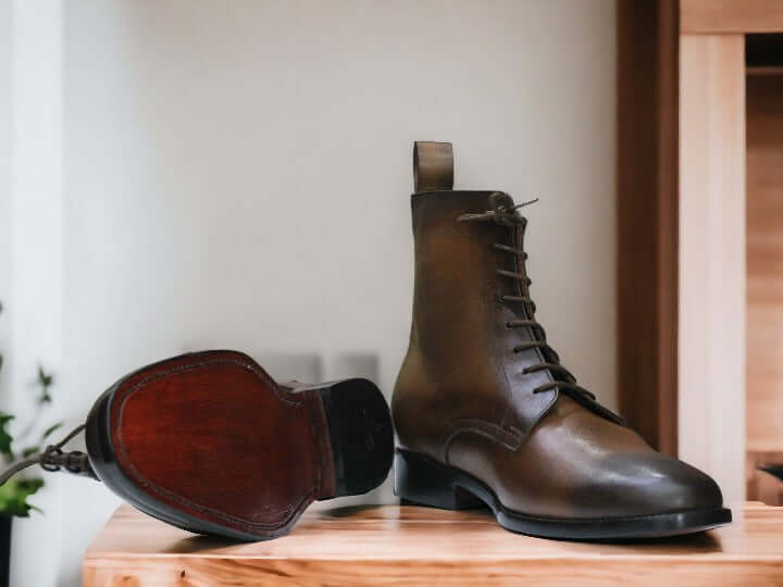 Expertly crafted with genuine leather, these Men's Brown Leather Boots offer both style and durability. Featuring a trendy buckle design and a sleek ankle cut, they are the perfect choice for dressy or casual occasions. Handmade with precision, these boots are a must-have addition to any man's wardrobe.