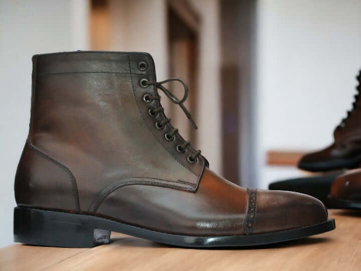 These Men's Brown Vintage Leather Boots are handcrafted using high-quality brown leather, making them durable and stylish. These versatile boots are perfect for any occasion, from dressing up for a night out to a more casual look for everyday wear. The buckle detail adds a touch of sophistication to these classic ankle boots.