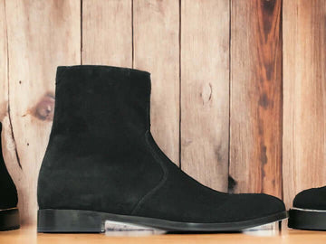 Expertly crafted with cow-hide leather and suede, these black ankle boots are the perfect combination of quality and style. Handmade by skilled artisans, these boots are designed for the winter season, providing warmth and durability. Elevate your footwear collection with these versatile and timeless boots.