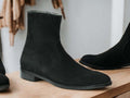 Expertly crafted with cow-hide leather and suede, these black ankle boots are the perfect combination of quality and style. Handmade by skilled artisans, these boots are designed for the winter season, providing warmth and durability. Elevate your footwear collection with these versatile and timeless boots.