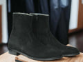 Expertly crafted with cow-hide leather and suede, these black ankle boots are the perfect combination of quality and style. Handmade by skilled artisans, these boots are designed for the winter season, providing warmth and durability. Elevate your footwear collection with these versatile and timeless boots.