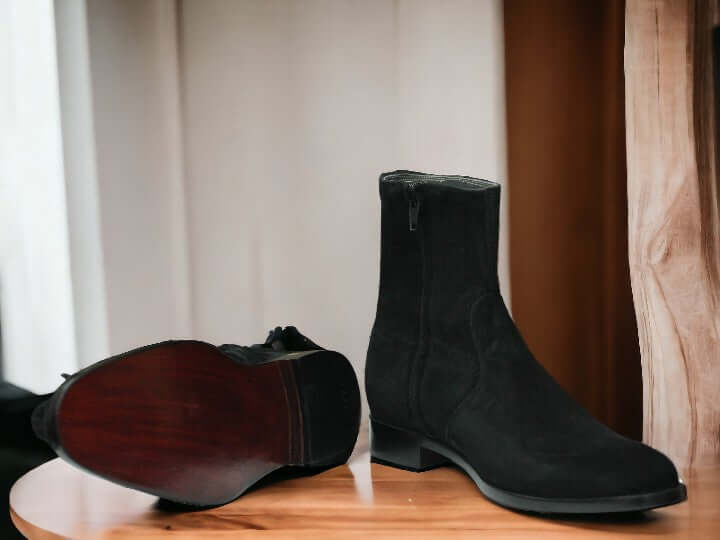 Expertly crafted with cow-hide leather and suede, these black ankle boots are the perfect combination of quality and style. Handmade by skilled artisans, these boots are designed for the winter season, providing warmth and durability. Elevate your footwear collection with these versatile and timeless boots.