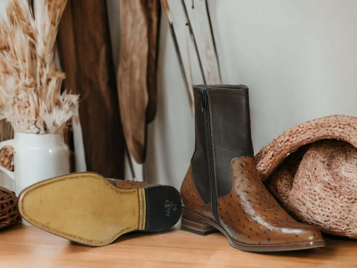 Elevate your style with Handmade Ostrich Print Brown Leather Boots for men. Ideal for both formal occasions and rugged adventures, these boots seamlessly blend luxury and durability. Crafted by hand from genuine ostrich leather, they offer comfort and longevity, enhancing any outfit effortlessly.