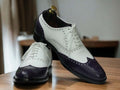 Step out in style with these Men's Purple White Oxfords - a perfect blend of elegance and sophistication. Featuring a classic wing tip brogue design and crafted from genuine leather, these shoes exude both style and superior quality, elevating your formal ensemble effortlessly.