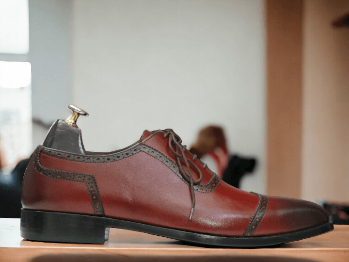 These Men's Burgundy Oxfords Leather Shoes are a sophisticated and stylish choice for any man. The lace up design ensures a secure and comfortable fit, while the soft leather material provides both durability and comfort. Elevate your dress shoe game with these timeless oxfords.