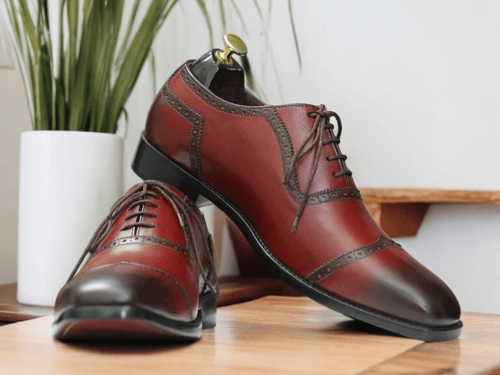 These Men's Burgundy Oxfords Leather Shoes are a sophisticated and stylish choice for any man. The lace up design ensures a secure and comfortable fit, while the soft leather material provides both durability and comfort. Elevate your dress shoe game with these timeless oxfords.