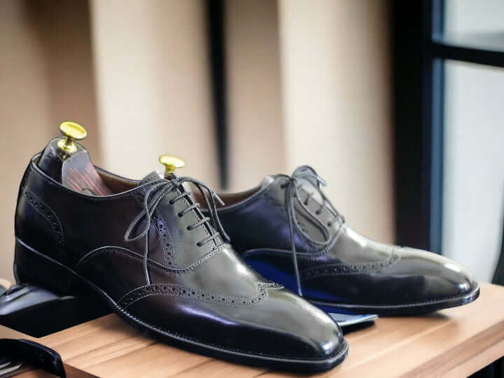 These timeless handmade men's black wingtip oxford shoes feature classic detailing for a sophisticated look. Crafted with superior quality leather, they are finished with a durable rubber sole for long-lasting wear. Perfect for formal or business events.