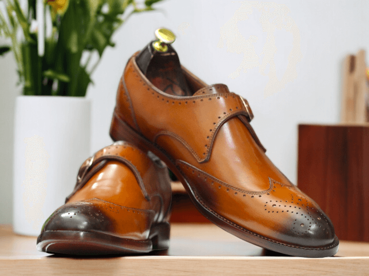 These Men Tan Monk Buckle Leather Shoes are the perfect combination of style and comfort. With a sleek lace-up design and monk buckle detail, these dress leather shoes are perfect for any formal occasion. Made from high-quality leather, they provide both durability and sophistication. Elevate your shoe game with these must-have shoes.