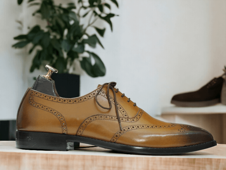 Introducing our Handmade Wing Tip Brogue Oxford Dress Leather Shoes, the perfect addition to any gentleman's wardrobe. Expertly crafted with a square toe and mustard dress leather, these shoes exude sophistication and style. Elevate your look with the finest quality craftsmanship.