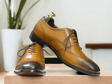 Introducing our Handmade Wing Tip Brogue Oxford Dress Leather Shoes, the perfect addition to any gentleman's wardrobe. Expertly crafted with a square toe and mustard dress leather, these shoes exude sophistication and style. Elevate your look with the finest quality craftsmanship.