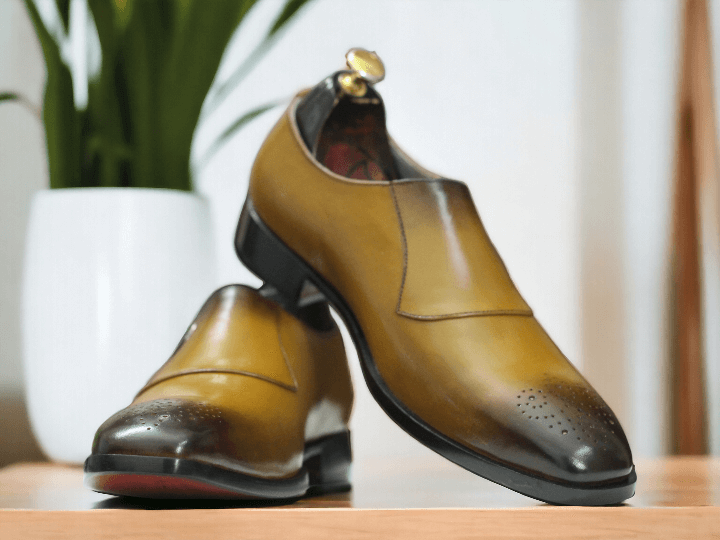 Expertly crafted and designed, these Tan Premium Single Strap Monk Shoes are the epitome of elegance and sophistication. Made with premium leather by skilled artisans, they offer the perfect combination of style and comfort. Elevate your wardrobe with these handmade men's shoes that are sure to make a statement.