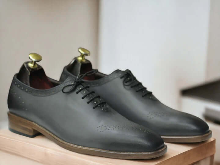 Elevate your style with our Men Handmade Grey Whole cut Oxfords Shoes. These Two Tone Oxfords are crafted with precision and attention to detail, ensuring a perfect fit and comfort for your feet. Handmade with top-quality materials, they exude sophistication and offer a timeless addition to your wardrobe.