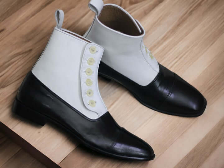 Take your style to the next level with these handmade men's button boots. Featuring a rich white and black design, they offer a timeless look and superior quality. Crafted from the finest materials, these boots will add classic style to any wardrobe.