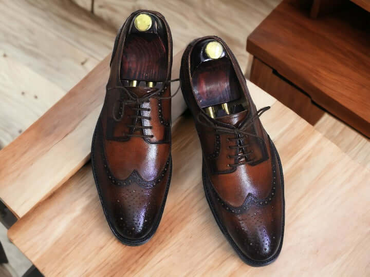 This sophisticated pair of Brown Wingtip Oxford Brogue Shoes exudes classic style and timeless elegance. Crafted from premium leather, these shoes will look sharp with any formal or casual ensemble. A perfect blend of traditional style with modern comfort.