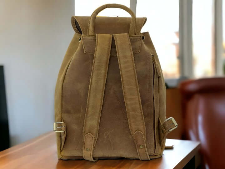 Expertly crafted from genuine leather, this handmade backpack is perfect for college students. The backpack features a front pocket for easy access to essentials, making it a practical and stylish choice for everyday use. Stay organized and look sophisticated with the Country Leather Backpack.