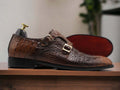 These handmade men's monk style Crocodile shoes are the perfect blend of comfort and style. Crafted with genuine crocodile leather, they are designed to be lightweight and durable for everyday wear. The unique monk style buckle closure ensures a secure fit every time. For a timeless look, opt for these classic handmade shoes.