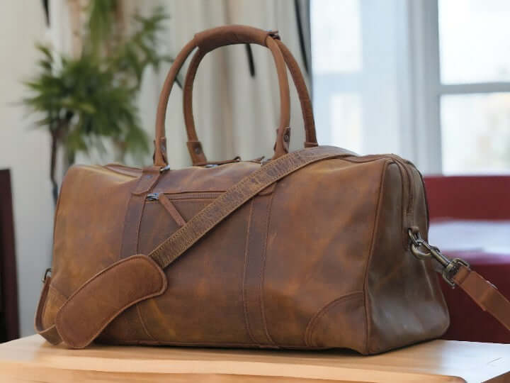 Introducing our Leather Sports Duffle, the perfect companion for your travels and workouts. Handcrafted from durable leather, this weekender bag doubles as a gym bag, vacation duffel, and overnight bag. With its sleek design and spacious interior, it's a must-have for any adventurer. Treat your loved one to the ultimate Valentine's Day gift.