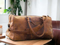 Introducing our Leather Sports Duffle, the perfect companion for your travels and workouts. Handcrafted from durable leather, this weekender bag doubles as a gym bag, vacation duffel, and overnight bag. With its sleek design and spacious interior, it's a must-have for any adventurer. Treat your loved one to the ultimate Valentine's Day gift.