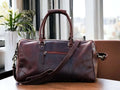 This full grain leather duffel bag is perfect for your next weekend getaway or vacation. Handmade with the highest quality leather, it offers durability and style. Its spacious design and sturdy construction make it the best gift for men and groomsmen. Upgrade your travel game with this luxurious weekender bag.