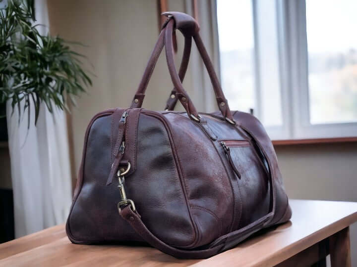 This full grain leather duffel bag is perfect for your next weekend getaway or vacation. Handmade with the highest quality leather, it offers durability and style. Its spacious design and sturdy construction make it the best gift for men and groomsmen. Upgrade your travel game with this luxurious weekender bag.