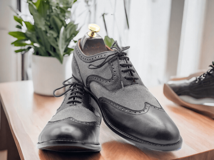 Expertly crafted from high-quality leather, these Men Grey Black Oxfords Wing Tip Leather Shoes are the perfect addition to any man's wardrobe. With its sleek design and classic wing tip style, these shoes are versatile enough for both formal and casual occasions. Elevate your style with these timeless Men Dress Shoes.