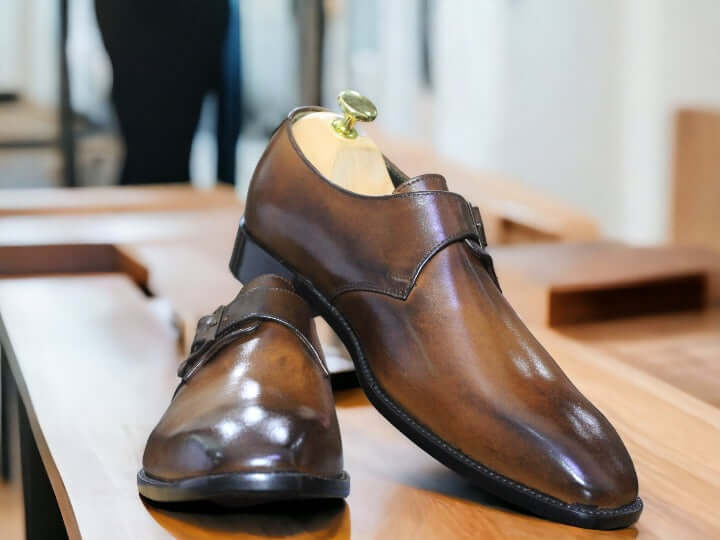 These handmade brown monk leather shoes are crafted from the finest quality leather for a sophisticated and timeless look. Stitched and seamed with precision, the leather upper is designed for lasting comfort and style. Perfect for any occasion, these shoes provide an undeniably polished look.