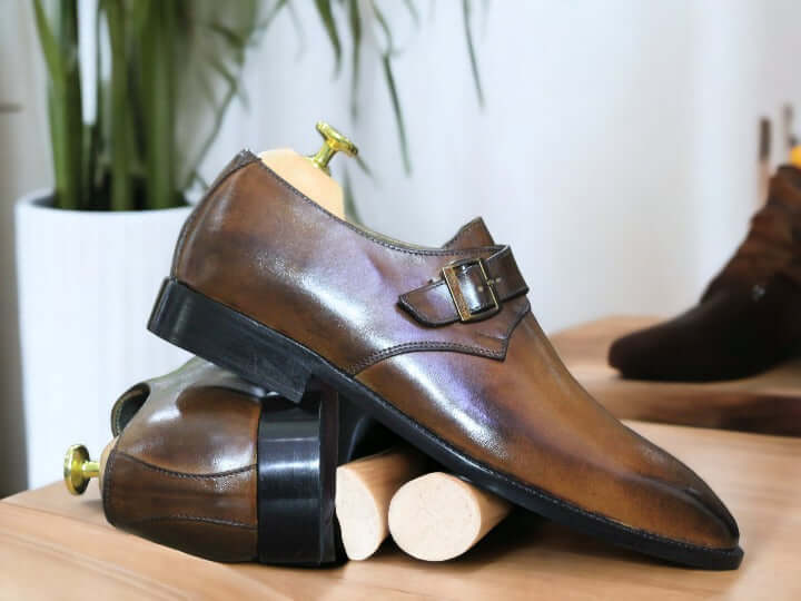 These handmade brown monk leather shoes are crafted from the finest quality leather for a sophisticated and timeless look. Stitched and seamed with precision, the leather upper is designed for lasting comfort and style. Perfect for any occasion, these shoes provide an undeniably polished look.