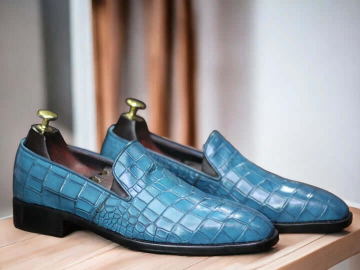 Expertly crafted for the modern man, these Men Loafer Alligator Shoes boast a sleek slip-on design in a striking sea green hue. Made from high-quality materials, these shoes offer both style and comfort. Elevate your wardrobe with these versatile and sophisticated shoes.