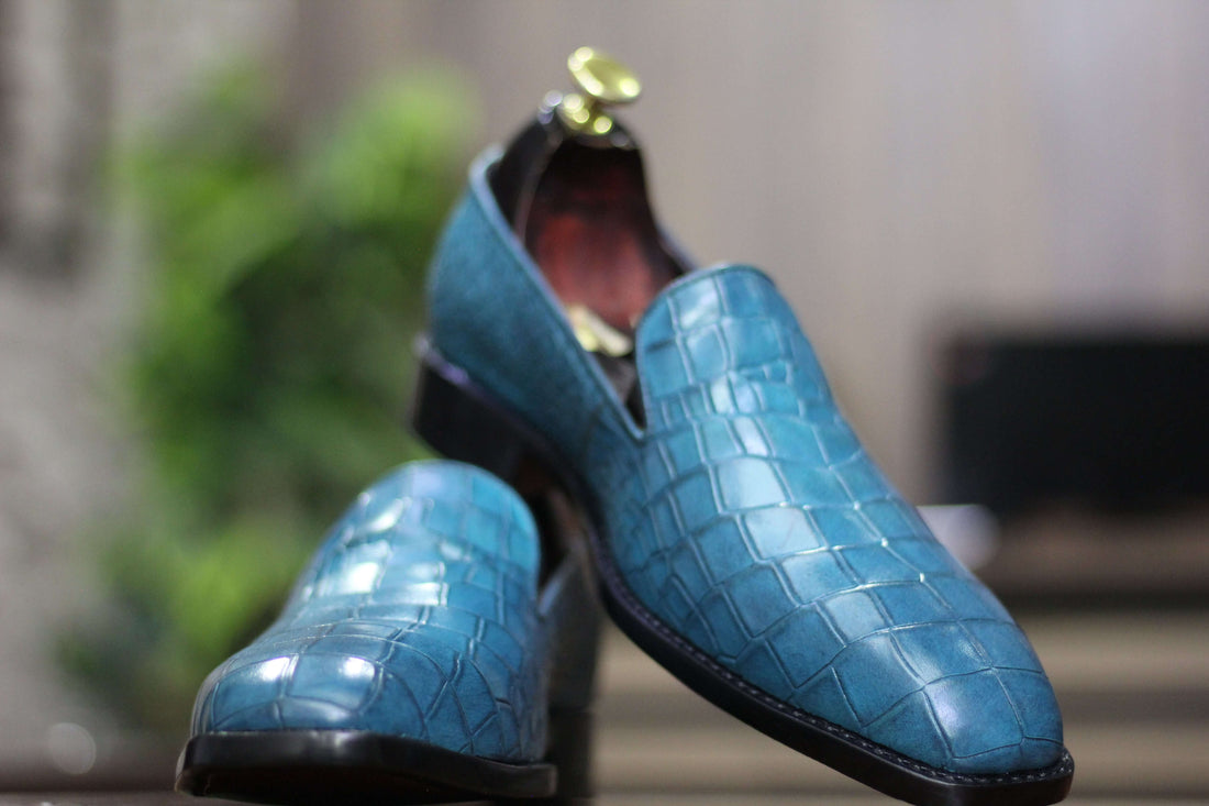 Expertly crafted for the modern man, these Men Loafer Alligator Shoes boast a sleek slip-on design in a striking sea green hue. Made from high-quality materials, these shoes offer both style and comfort. Elevate your wardrobe with these versatile and sophisticated shoes.