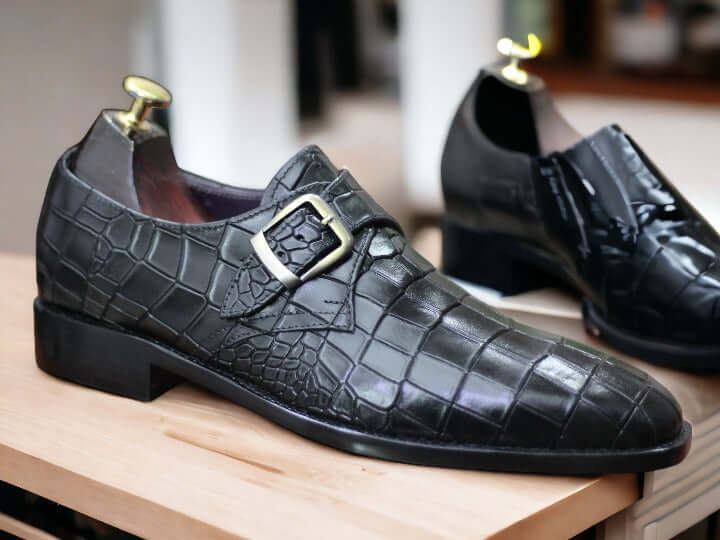 These Handmade Men Black Monk Alligator Shoes are perfect for any formal occasion. Meticulously crafted from premium alligator leather, they provide a comfortable fit as well as classic style. The soles are made from high-quality rubber—durable enough for any situation. With their timeless design, these shoes make a perfect addition to any wardrobe.