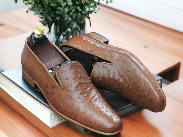 Elevate your look with these men's Ostrich print loafers. Crafted with genuine leather and designed with a timeless silhouette, these loafers are perfect for any formal or smart casual attire. The ostrich print gives these shoes extra texture and style, making you look fashionable and sophisticated.