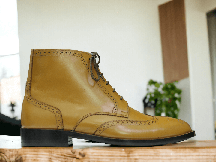 Expertly handcrafted with genuine tan leather, these ankle-high boots are the perfect blend of style and functionality. Designed for the modern man, these dress shoes offer superior comfort and durability, making them the perfect addition to your wardrobe. Elevate your fashion game with these handmade boots.