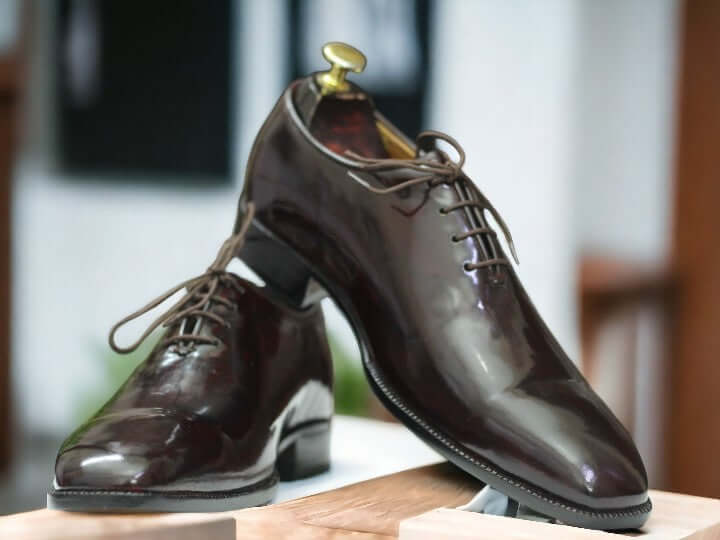 Elevate your formal attire with these Men's Brown Handmade Oxford Shoes. Made with patent leather, these shoes are both stylish and professional, perfect for the office. Handcrafted with precision, these shoes are a must-have for any gentleman looking to make a statement.