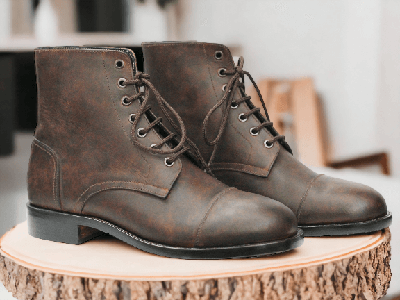 Experience the timeless elegance of our Bespoke Brown Vintage Look Boots. Crafted with quality leather, these ankle high designer boots offer both style and durability. Perfect for any occasion, elevate your wardrobe with this essential addition.