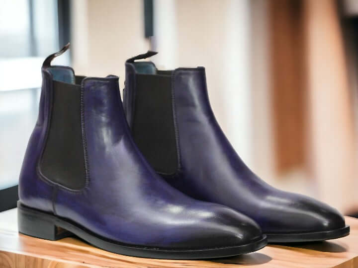 Expertly crafted by hand, these Navy Blue Chelsea Leather Boots are the perfect blend of style and comfort. Slip them on effortlessly and enjoy the durability and sleek design of these ankle boots. Elevate your wardrobe with these high-quality, handmade boots.