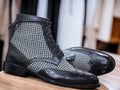 These stylish designer boots provide the perfect blend of classic and modern. Made of black leather and tweed, these ankle-high boots are designed to be comfortable and fashionable. A must-have for the modern man.