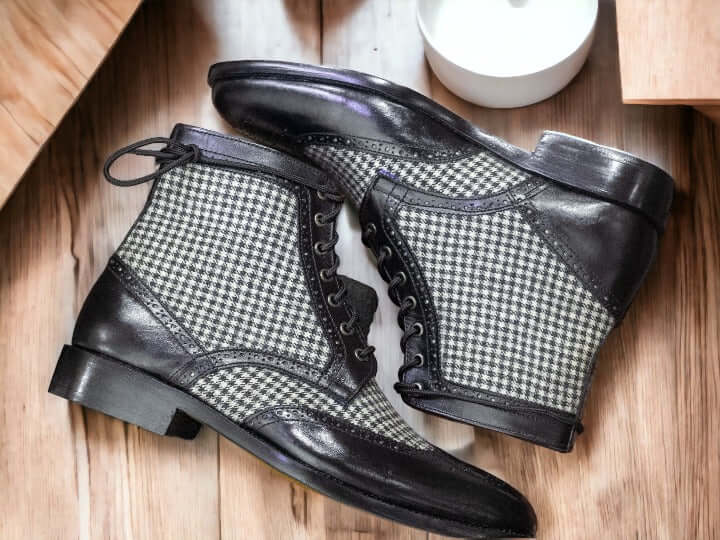 These stylish designer boots provide the perfect blend of classic and modern. Made of black leather and tweed, these ankle-high boots are designed to be comfortable and fashionable. A must-have for the modern man.