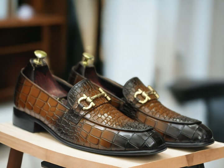 Expertly crafted for the refined gentleman, these Horse Bit Handmade Alligator Print Penny Loafer Shoes are a timeless addition to any wardrobe. Handmade with two-tone detailing, these shoes exude luxury and sophistication. Elevate your style and step out in confidence with these statement-making shoes.