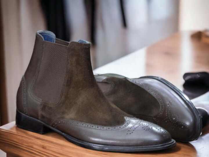 These Men Brown Chelsea Boots are a stylish combination of luxury, fashion and function. Crafted from premium brown suede, this ankle-high boot features a hand-painted finish for a sophisticated look. Perfect for formal and casual occasions.