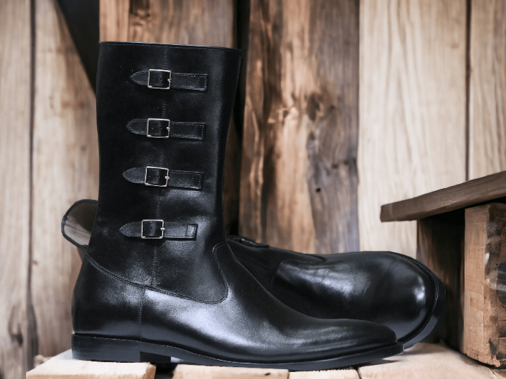 Expertly crafted by hand, these Men's Black Leather Boots offer a timeless and stylish addition to your wardrobe. Featuring a buckle closure and long leather design, these boots provide durability and sophistication. Perfect for any occasion, these boots will elevate any outfit.