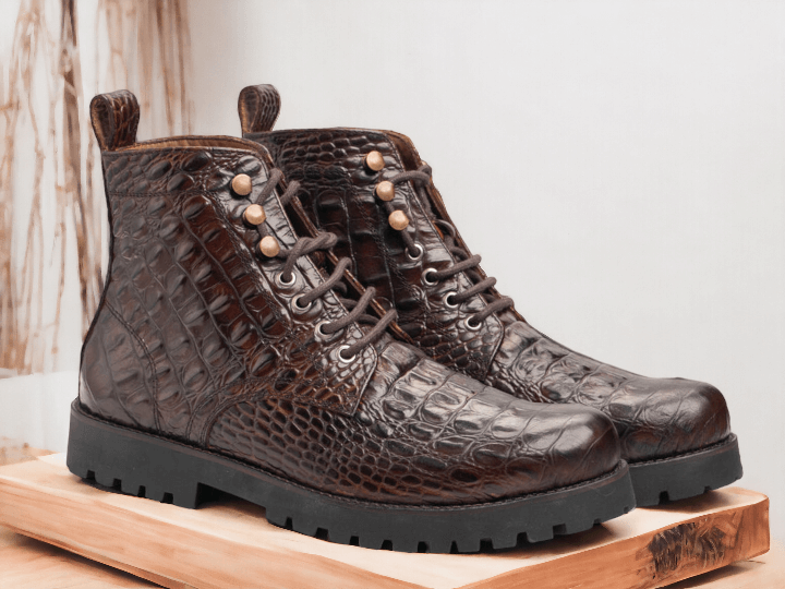 Introducing our Handmade Brown Crocodile Boots for the discerning gentleman. Made from high-quality leather and delicately crafted by skilled artisans, these designer boots are the epitome of luxury and style. Stand out from the crowd with these unique and exquisite boots.