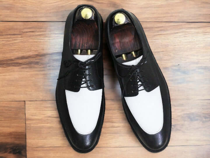 Introducing our Men's Black & White Derby Leather Shoes - the perfect addition to any sophisticated wardrobe. Made from high-quality leather, these shoes offer both style and durability. With a sleek black and white design, they are sure to make a statement. Elevate your look and step out in confidence with our Derby Shoes.