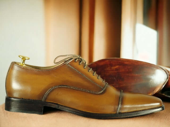 Expertly crafted with genuine leather, these handmade tan dress shoes are the perfect choice for any formal occasion. The sleek and stylish design exudes sophistication, while the high-quality materials ensure durability and comfort. Elevate any outfit with these must-have shoes for men