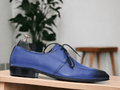 These men's Derby-style shoes feature a unique two-tone design, combining blue and designer elements for a stylish yet professional look. Made for the office, these shoes are both fashionable and functional. Elevate your work wardrobe with these modern dress shoes.