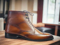 Step out in style with our Men's Ankle High Wing Tip Dress Boots, seamlessly blending classic and fashionable aesthetics. Crafted from brown leather, these boots not only elevate your style but also provide essential ankle-high support. Whether it's a formal event or a dressy occasion, these boots are a must-have for the fashion-forward man