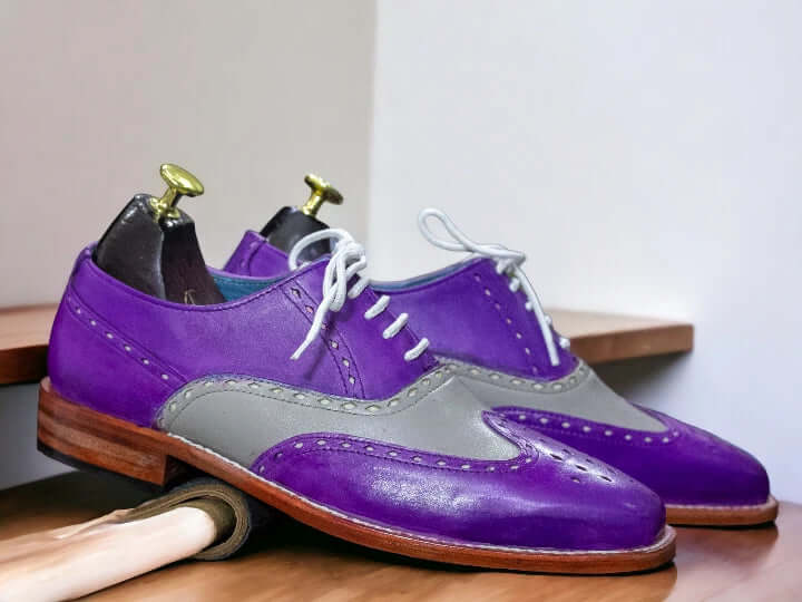 Elevate your style with our designer men's purple grey leather dress shoes. Crafted with precision and attention to detail, these brogue oxfords add a touch of sophistication to any outfit. Made from high-quality leather, these shoes provide both durability and comfort. Perfect for any formal occasion, impress with every step.