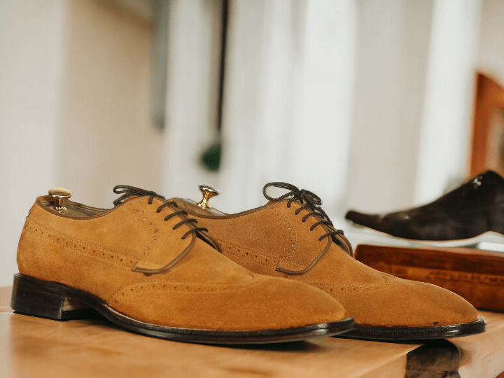 Elevate your style with our Men's Handmade Tan Wing Tip Lace Up Shoes. Expertly crafted with a timeless design, these shoes provide both comfort and sophistication for any occasion. The handmade construction and lace up closure ensure a perfect fit every time. Elevate your wardrobe with these stylish shoes.